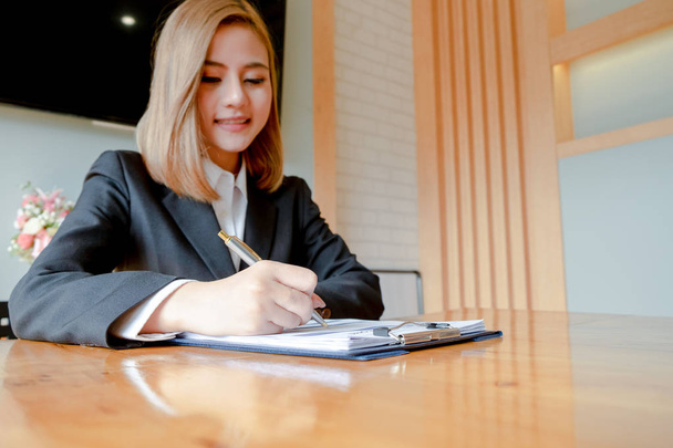 young woman sitting for candidate at job interview and writing r - Photo, Image