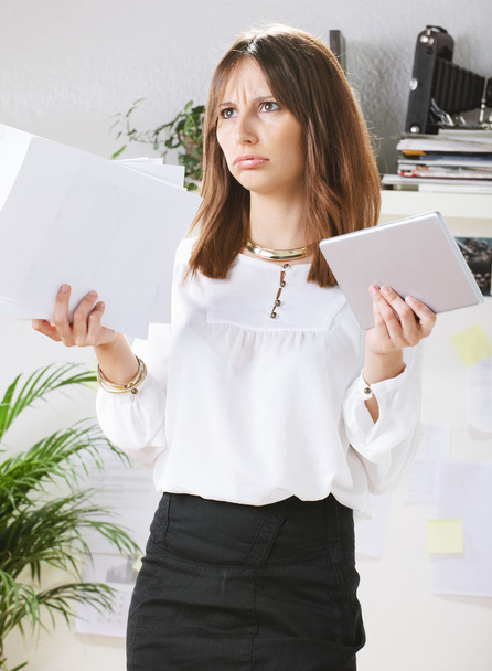 Stressed young creative designer woman in office. - 写真・画像