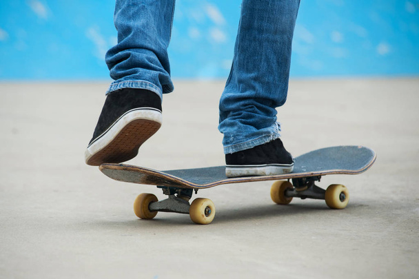 Skateboarder riding skateboard at skate park.  - Фото, изображение