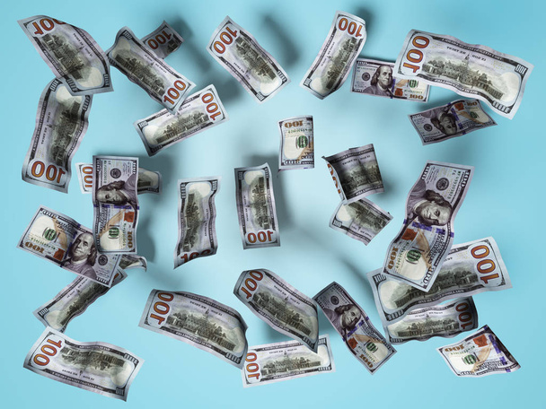 Dollar bills concept falling on white floor 3d render on blue ba - Фото, изображение
