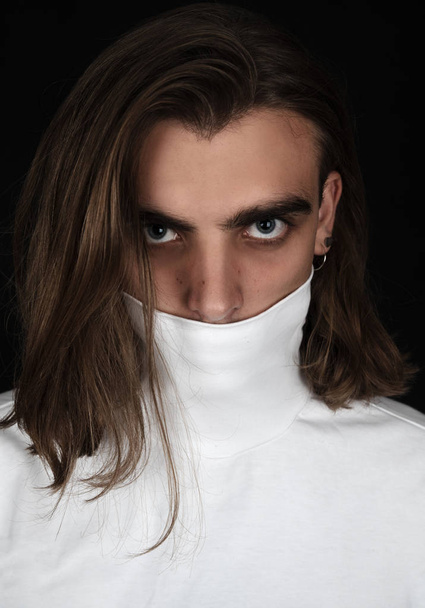 Portrait of young man in white turtle neck  sweater - Fotografie, Obrázek