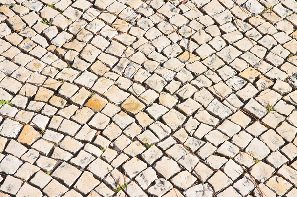 Tyypillinen portugalilainen lattia valmistettu pienistä kirkkaista kivistä
  - Valokuva, kuva