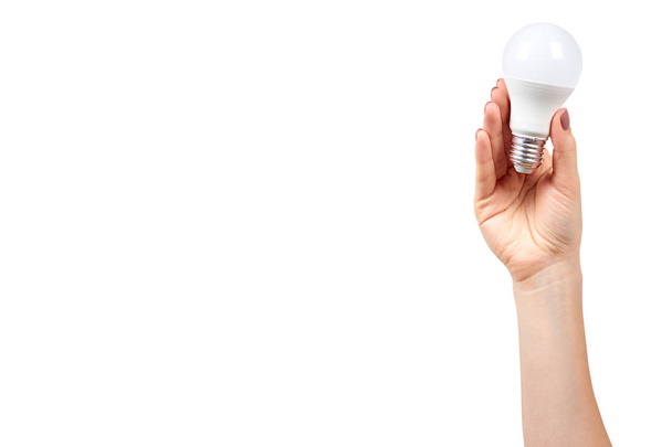 Hand with white LED bulb, eco friendly lamp, modern equipment. - Foto, afbeelding