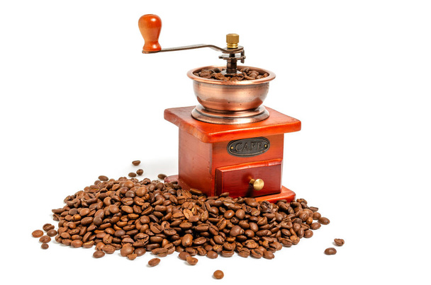 Retro wooden coffee grinder on white background with coffee beans. - Foto, Imagen