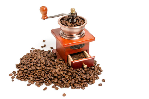 Retro wooden coffee grinder on white background with coffee beans. - Foto, Imagen