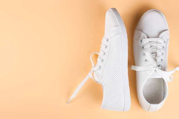 white sneakers on color background. copy space. - Photo, Image