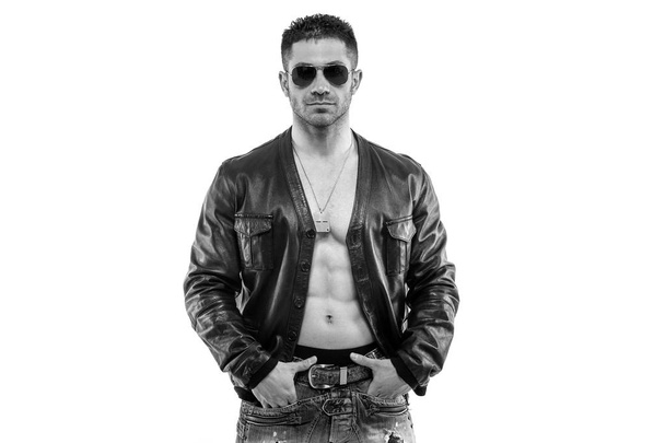 Confident young man portrait wearing leather jacket. Black and white image. - Фото, зображення