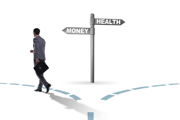 Businessman choosing between money and health - Photo, Image