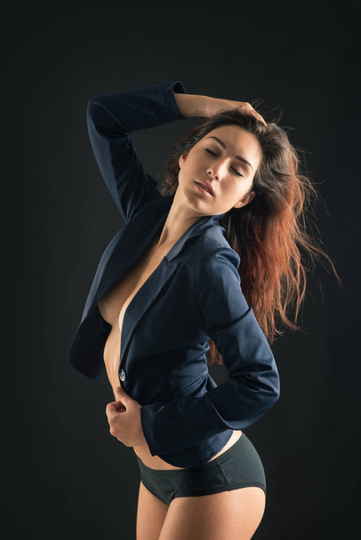 Young sensual woman beauty portrait against black background. - Foto, Bild