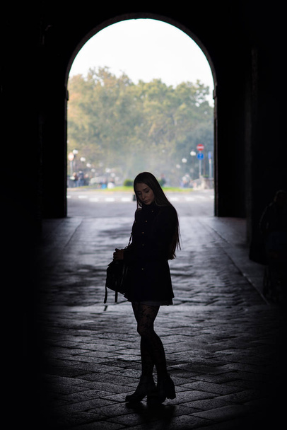 Silouette portrait of young woman outdoors. Parma, Italy. - Фото, зображення