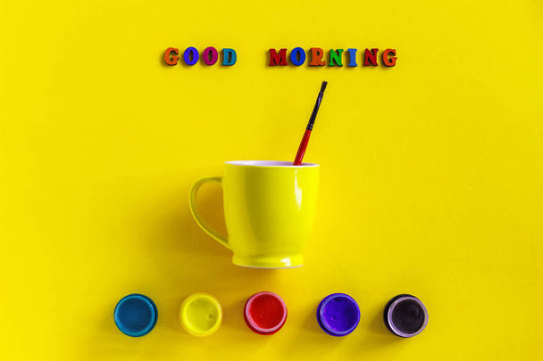 Lettering Good morning, jars gouache and yellow cup with paintbr - Foto, imagen