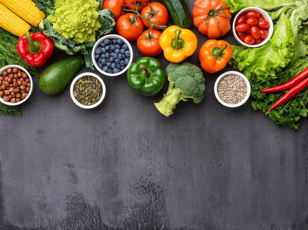 Healthy eating ingredients: fresh vegetables, fruits and superfood. Nutrition, diet, vegan food concept. Concrete background - Zdjęcie, obraz