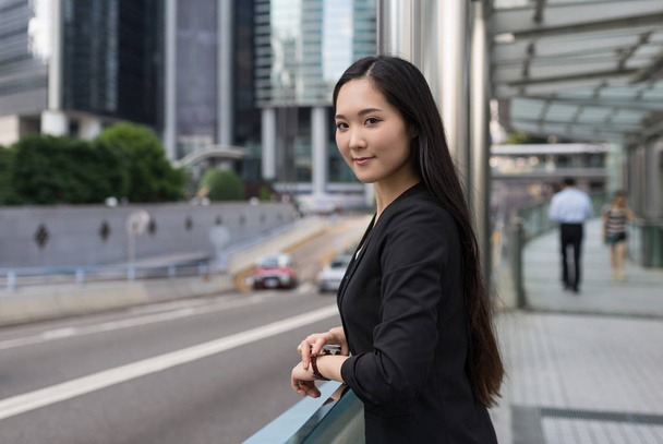 Confident young businesswoman portrait in Hong Kong.  - Photo, image
