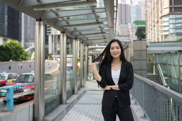 Young confident businesswoman portrait in Hong Kong.  - Фото, изображение