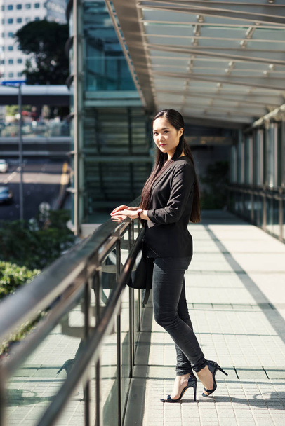 Young businesswoman portrait in Hong Kong in a sunny day. - Photo, image