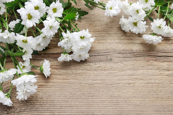 White chrysanthemum flowers on wooden background - Fotó, kép