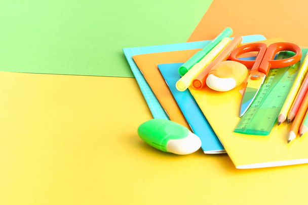 Back to school background. School supplies bright colors at abstract colored background. Education concept. Top view. Copy space - Photo, Image