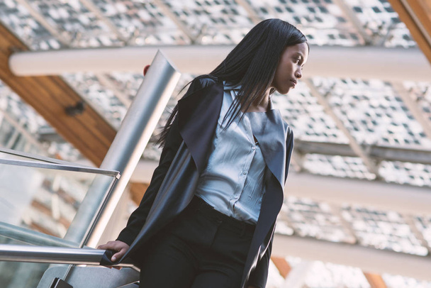 Portrait of young mixed race latina businesswoman in modern business district   - Foto, Bild