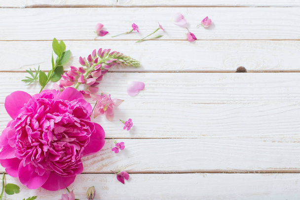 pink beautiful flowers on white wooden background - Zdjęcie, obraz