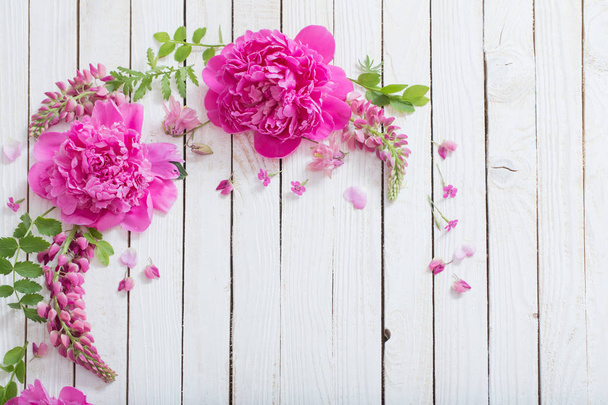 pink beautiful flowers on white wooden background - Foto, Imagem