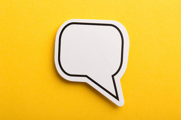 Speech Bubble Isolated On Yellow Background - Foto, afbeelding