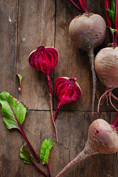 Bunch of fresh organic beetroot on wooden background. Concept of diet, raw, vegetarian meal. Farm, rustic and country style - Foto, immagini