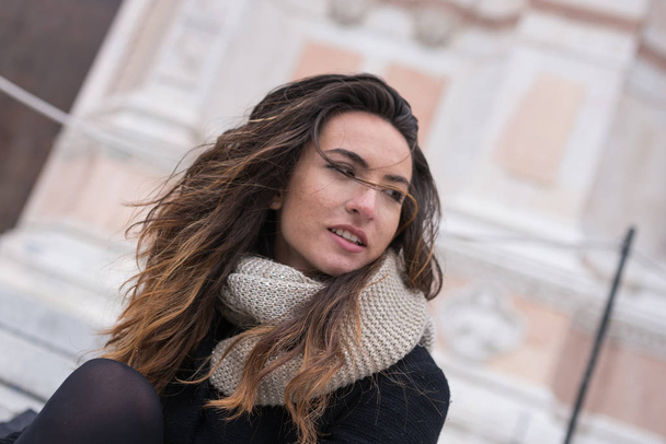 Beautiful woman close up portrait outdoors in Bologna, Italy. - Foto, afbeelding