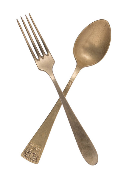 Beautiful old vintage crossed knife and fork isolated on white b - Photo, Image