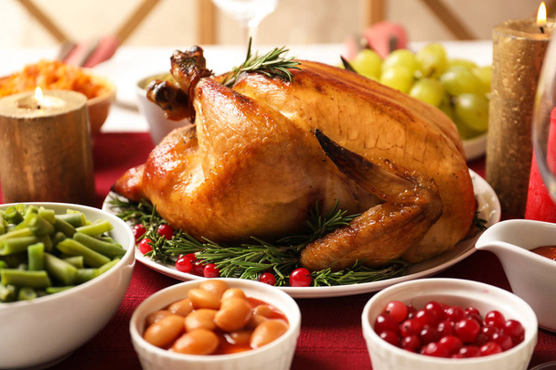 Traditional festive dinner with delicious roasted turkey served on table - Fotoğraf, Görsel