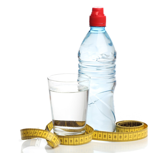 Bottle with water and a measuring tape isolated - Valokuva, kuva