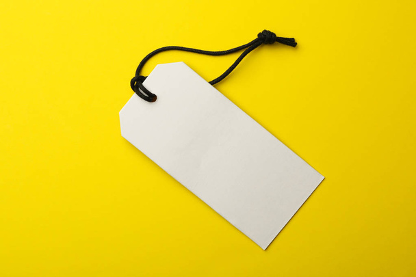 Cardboard tag with space for text on color background, top view - Fotó, kép