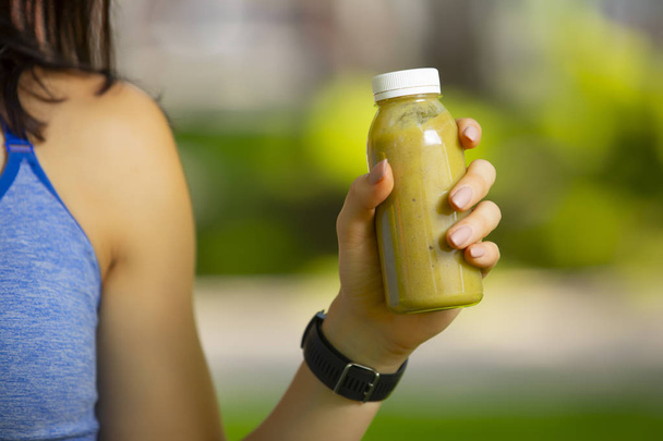 Smoothie bottle in woman hand - 写真・画像