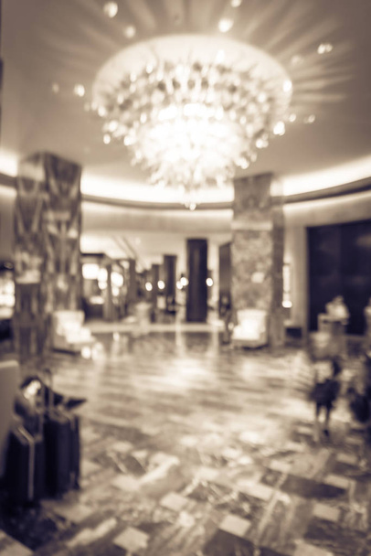 Φιλτραρισμένη εικόνα λόμπι θολό φόντο με αποσκευές επισκέπτη στο αμερικανικό ξενοδοχείο - Φωτογραφία, εικόνα