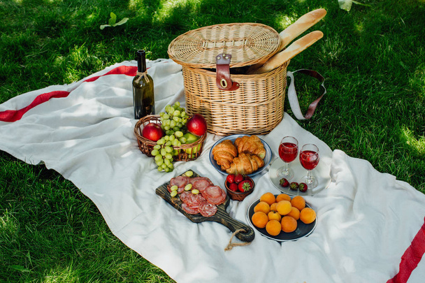 Summer picnic in the park on the green grass - Photo, Image