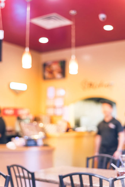 Blurry background waiters serving food at compact Vietnamese noodle restaurant - Photo, Image