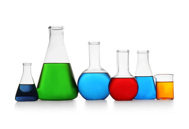 Chemistry glassware with color samples isolated on white - Photo, image