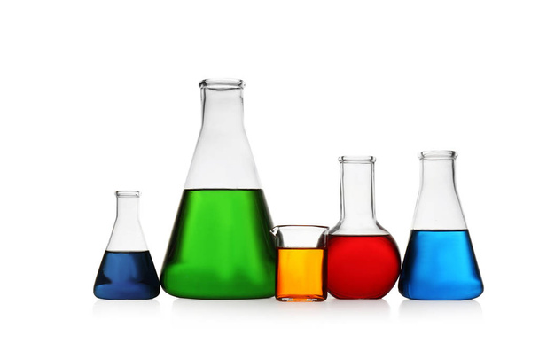 Chemistry glassware with color samples isolated on white - Foto, imagen
