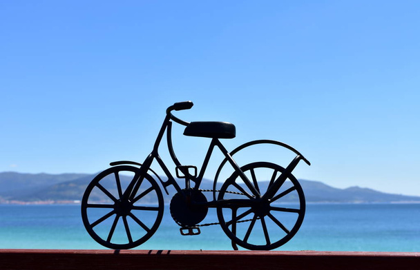 Beach with black iron bicycle. Galicia, Spain. - Foto, imagen