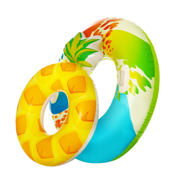 Different bright inflatable rings on white background. Summer holidays - Photo, image