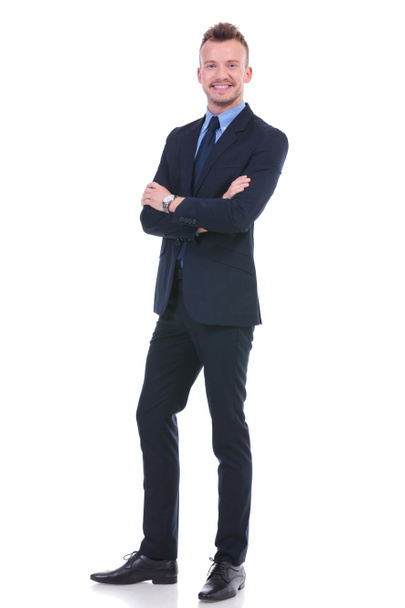 business man standing with arms folded - Foto, Bild
