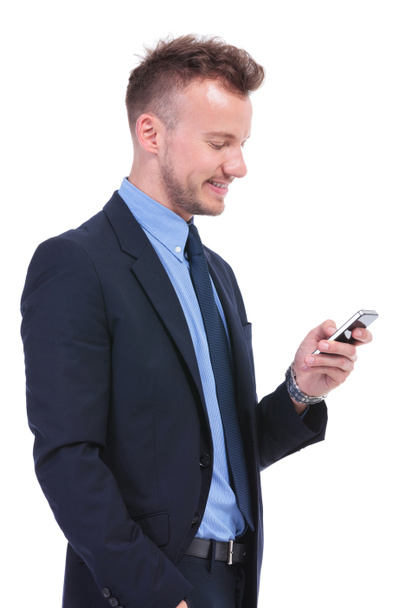 business man texting on his phone - Фото, изображение