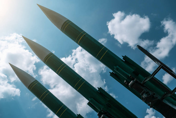 Ballistic missiles on blue sunny sky background, anti aircraft forces, military industry. War and peace concept - Photo, Image