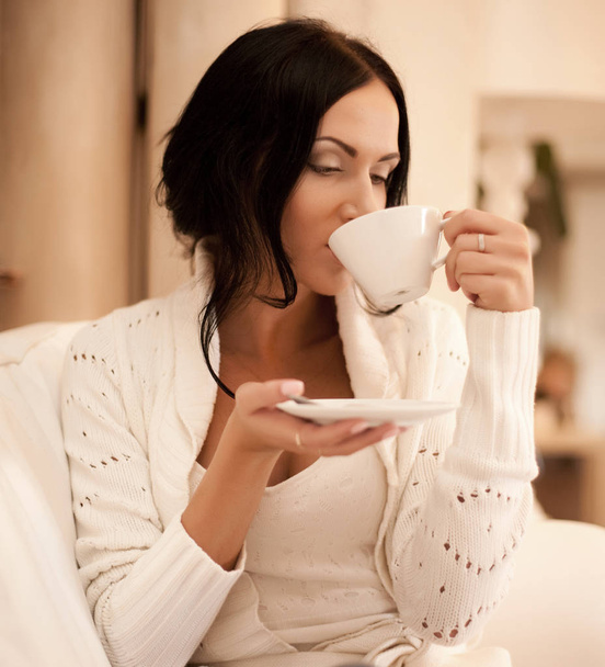  female holding a mug of coffee  - Fotó, kép
