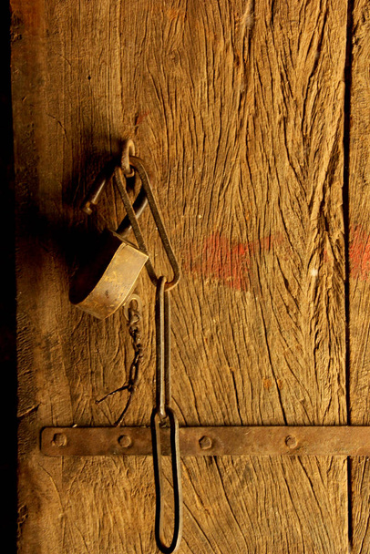 Old door lock on wooden background - Fotó, kép