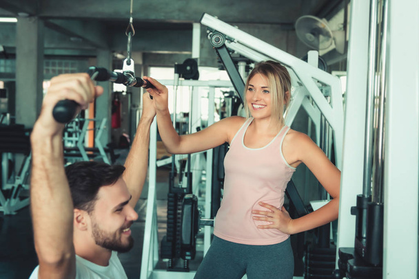Portrait of Couple Love in Fitness Training With Bodybuilder Equipment., Young Couple Caucasian are Working Out and Training Together in Gym Club., Sport and Healthy Concept. - Photo, Image