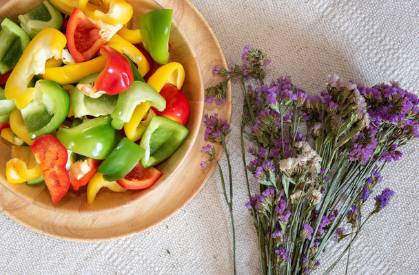 Colorful of Fresh Sweet Peppers in a Wooden Bowl, Raw Organic Vegetable on a Table Ready to Cooking in The Kitchen Room. Ingredient Food. - Photo, Image