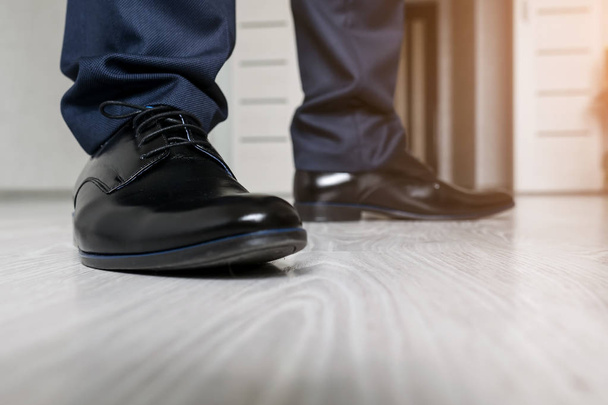 men feet in black shoes close-up - Fotoğraf, Görsel