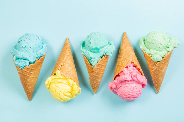 Pastel ice cream in waffle cones - Фото, изображение
