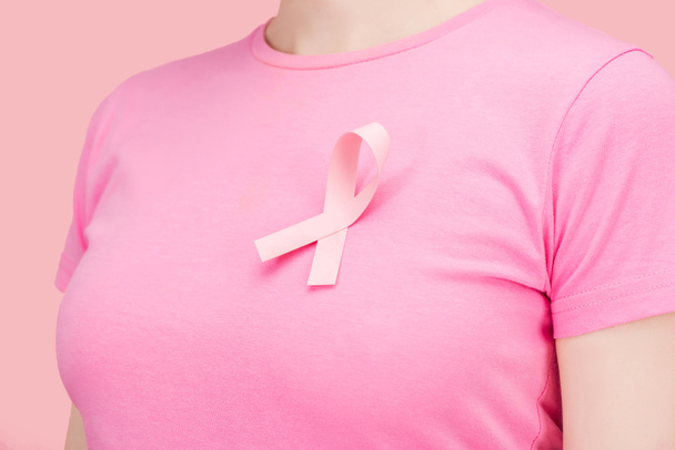 close up view of woman in pink t-shirt with breast cancer sing isolated on pink - Photo, Image