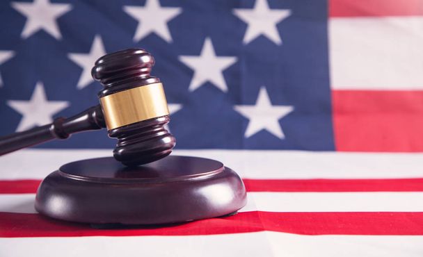 Judge gavel with American flag. - Фото, изображение